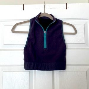 Fabletics zip up high neck crop with cutout details in back.
